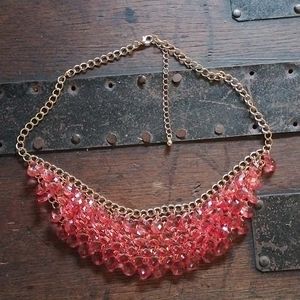 Orange chain necklace.
